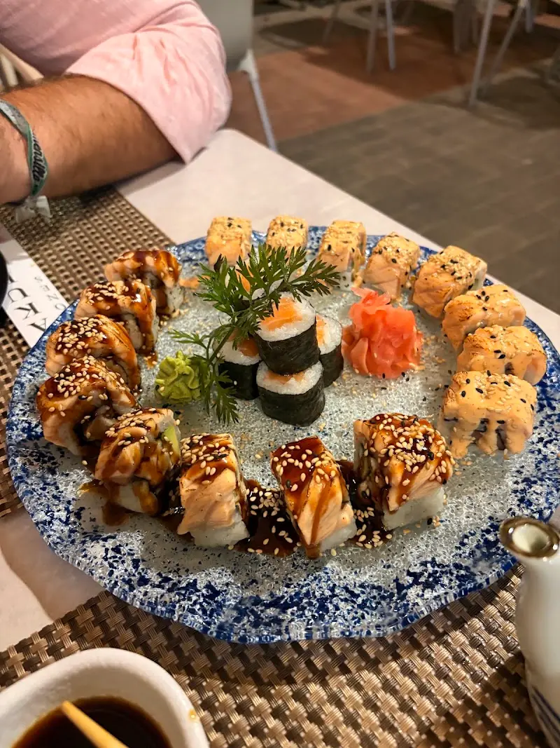 Platter of assorted sushi with seared salmon rolls, maki, ginger and wasabi at Sakura